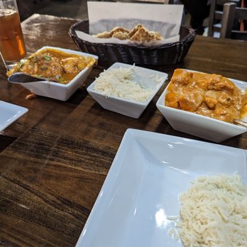 Aha The Indian Grill - Spicy chicken Tikka Masala on the right and Hyderabadi chicken curry on the left. - Indian Near Me - Spring Hill, Tennessee