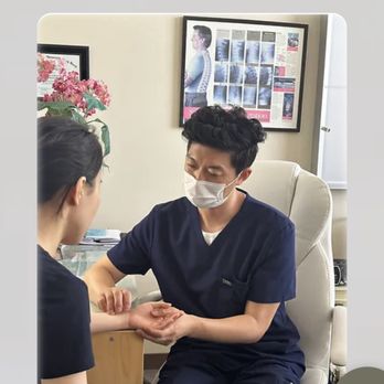 Lena Kim Acupuncture - Dr. Kim is taking the patient's pulse. - Acupuncture Near Me - Newport Beach, California Lena Kim Acupuncture - Dr. Kim is taking the patient's pulse. - Acupuncture Near Me - Newport Beach, California