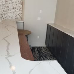 Wholesale Granite Marble & Tile - Calacatta classique quartz countertop on a bar.