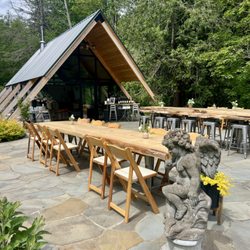 Chateau NoElle - Handcrafted from trees harvested right here on our land, our cedar slab tables bring warmth and soul to every pour.