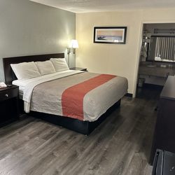 Econo Lodge - King bed inside a room