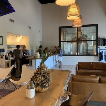 Desert Door - The custom-made bar and the still in the window. - Distilleries Near Me - Driftwood, Texas Desert Door - The custom-made bar and the still in the window. - Distilleries Near Me - Driftwood, Texas