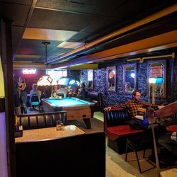 Capitol Hotel - Pipe Room - Busy pool table and lots of TV's.