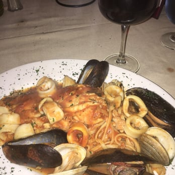 Magna Restaurant - Red Snapper with mussels, clams and calamari in a light tomato sauce - Italian Near Me - Flushing, New York