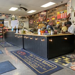 a woman standing at the counter a woman standing at the counter