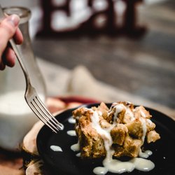 Hoppin Johns - New Orleans Bread Pudding. Served with Cinnamon Whipped Cream and Bourbon Sauce.