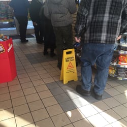 Royal Farms Store - 2 people working a store with a steady rush of customers.