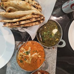 Garlic Naan, saag aloo, butter chicken, and lamb tikka masala