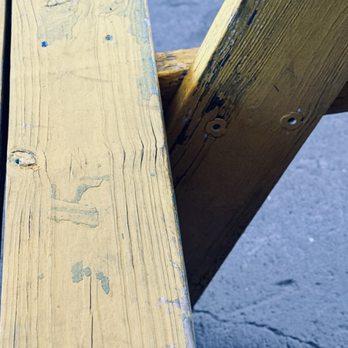 Rail Yards Market - Seat and leg on a picnic table - Farmers Market Near Me - Albuquerque, New Mexico Rail Yards Market - Seat and leg on a picnic table - Farmers Market Near Me - Albuquerque, New Mexico