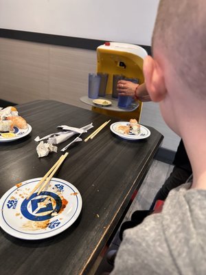 Kura Revolving Sushi Bar by null