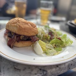 Steakhouse burger with Caesar side salad Steakhouse burger with Caesar side salad