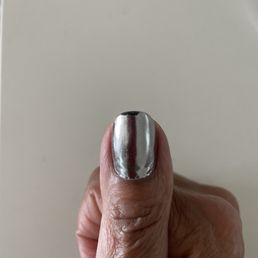 Chipped Chrome gel nail less than 24 hrs after getting them done by Jenny.