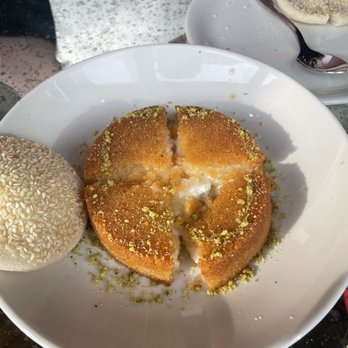 ilili DC - KNAFE BIL JIBNEH - an inverted sweet cheese tart, semolina crust, orange blossom syrup, sesame pita pillows. - Lebanese Near Me - Washington, DC, District of Columbia ilili DC - KNAFE BIL JIBNEH - an inverted sweet cheese tart, semolina crust, orange blossom syrup, sesame pita pillows. - Lebanese Near Me - Washington, DC, District of Columbia