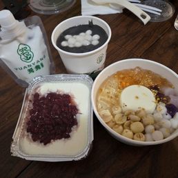 Clockwise: black sesame paste, soymilk pudding dessert, double layer milk custard with red bean Clockwise: black sesame paste, soymilk pudding dessert, double layer milk custard with red bean