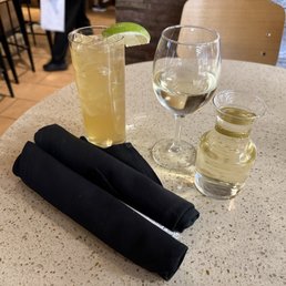 Cocktail and 9 ounce pour of wine Cocktail and 9 ounce pour of wine