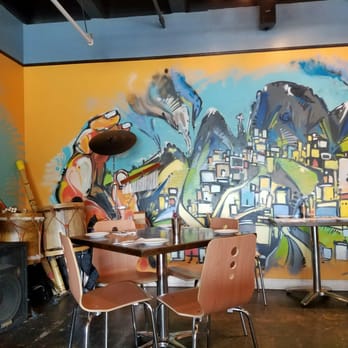 Andes Cafe - Beautiful mural with instruments for a band - Latin American Near Me - Houston, Texas