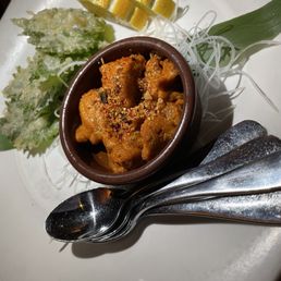 Seared Uni with deep fried shiso leaf. Seared Uni with deep fried shiso leaf.