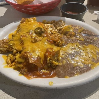 Dos Molina's Mexican - Chilaquiles con chorizo and red sauce and a side of refried beans. - Mexican Near Me - Fort Worth, Texas