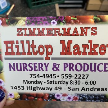 Hilltop Market - a person holding up a sign - Grocery Near Me - San Andreas, California Hilltop Market - a person holding up a sign - Grocery Near Me - San Andreas, California