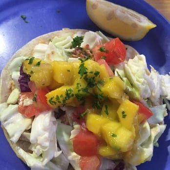 Coconuts Fish Cafe - Fish Tacos (2) served with white corn tortillas, slaw, tomatoes, cheese, and mango salsa (this is what makes the dish!). It has great flavor - Seafood Near Me - Kihei, Hawaii