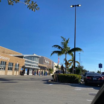 Walmart Supercenter - a parking lot with cars and palm trees - Grocery Near Me - Hollywood, Florida Walmart Supercenter - a parking lot with cars and palm trees - Grocery Near Me - Hollywood, Florida