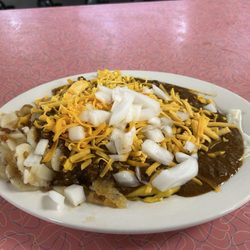 Famous Slider dish topped with shredded cheese and chopped onion