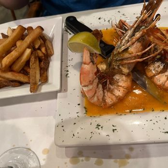 Lisbon Portuguese Restaurant - Gambas à Moçambique
(Grilled Tiger Shrimp) - Portuguese Near Me - Orlando, Florida Lisbon Portuguese Restaurant - Gambas à Moçambique
(Grilled Tiger Shrimp) - Portuguese Near Me - Orlando, Florida