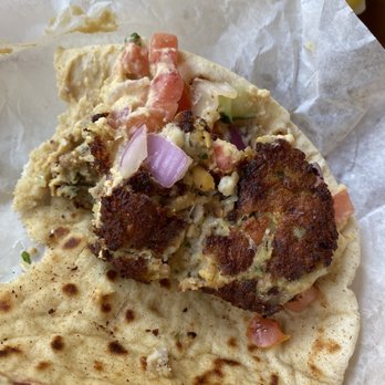 George's Greek Cafe - Inside the Stuffed Falafel (hummus, tomatoes, cucumbers, falafel with gyro, chunk's of feta inside). Crispy and flavorful - Greek Near Me - Long Beach, California George's Greek Cafe - Inside the Stuffed Falafel (hummus, tomatoes, cucumbers, falafel with gyro, chunk's of feta inside). Crispy and flavorful - Greek Near Me - Long Beach, California