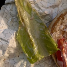 a sandwich with lettuce and bacon a sandwich with lettuce and bacon