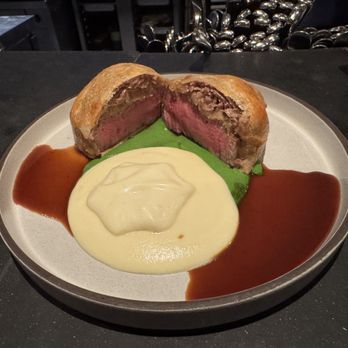 Trust - Beef Wellington on top of a portobello mushroom topped with layered with thin sliced brisket with Joel Robuchan mashed potatoes - Tapas/Small Plates Near Me - Santa Ana, California Trust - Beef Wellington on top of a portobello mushroom topped with layered with thin sliced brisket with Joel Robuchan mashed potatoes - Tapas/Small Plates Near Me - Santa Ana, California