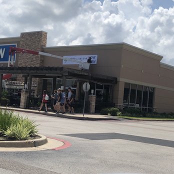 Ember & Greens - Outside temp sign being hung. - New American Near Me - Houston, Texas