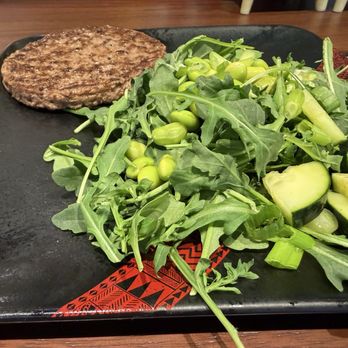 Trader Vic's - Side salad with beef patty - Tiki Bars Near Me - Oakland, California