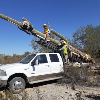 AZ Cactus & Tree Service - two men working on a utility truck - Landscaping Near Me - Tucson, Arizona AZ Cactus & Tree Service - two men working on a utility truck - Landscaping Near Me - Tucson, Arizona