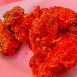 Joe's House Wings tossed with Buffalo sauce, blue cheese and garlic