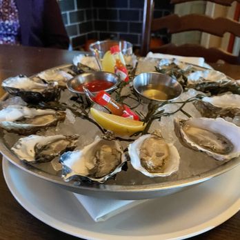 The Bungalow Kitchen - Oysters! Look at the cute presentation with the hot sauce. - New American Near Me - Tiburon, California The Bungalow Kitchen - Oysters! Look at the cute presentation with the hot sauce. - New American Near Me - Tiburon, California