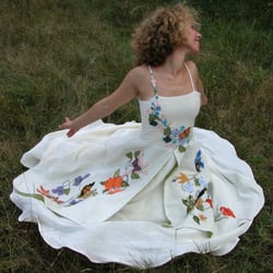 Tara Lynn - Fiorella is a unique embroidered wedding dress with colorful appliques. A stunning non-traditional wedding dress option.