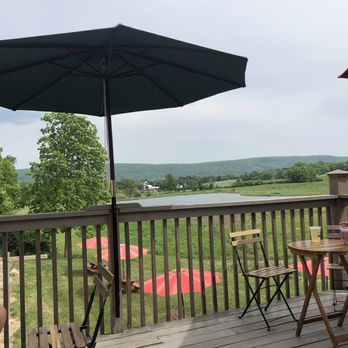 Apple Dave's Distillery - a deck with tables and umbrellas - Distilleries Near Me - Warwick, New York Apple Dave's Distillery - a deck with tables and umbrellas - Distilleries Near Me - Warwick, New York