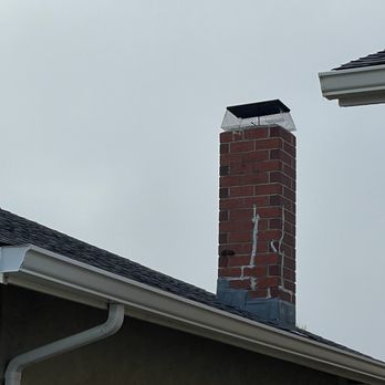 NC Roofing Solution - Old chimney with a new chimney seal mesh installed (front view). - Roofing Near Me - Walnut Creek, California