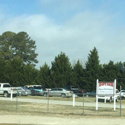 Boykin Auto Performance - Photo of repair shop sign, vehicles, and building.