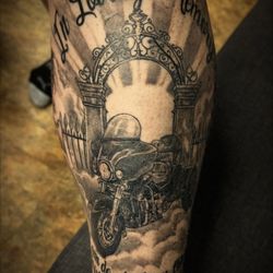 Apex Tattoo Factory - memorial motorcycle parked outside the gates, full leg sleeve. black and grey
