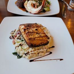 Pan seared salmon with risotto, and the surf and turf special. Pan seared salmon with risotto, and the surf and turf special.