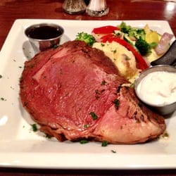 Succulent and delicious Prime Rib with garlic mashed potatoes and sautéed vegetables.