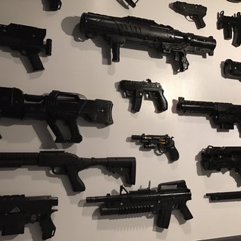 The Consulate - More of the men's room. Nerf guns painted black. Genius - Specialty Food Near Me - Atlanta, Georgia