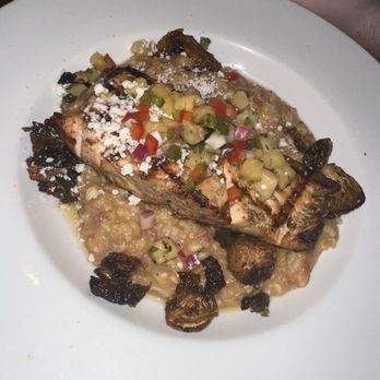 Hemingway's Tavern - Special: Salmon with pineapple salsa with chorizo risotto and crispy Brussel sprouts - New American Near Me - Melbourne, Florida