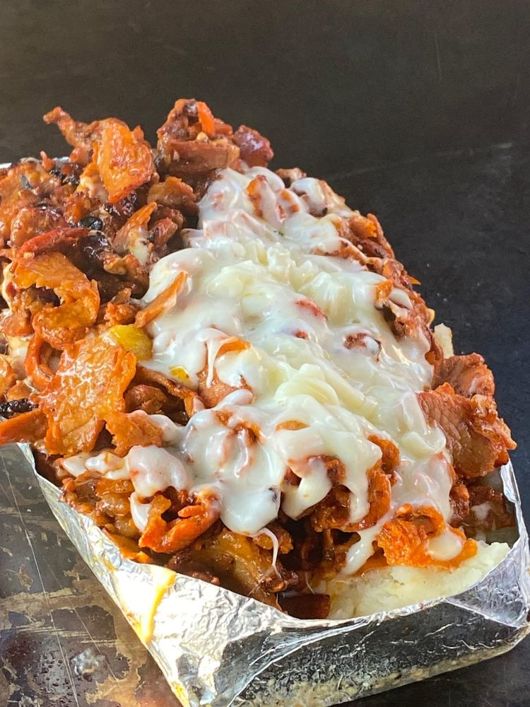 Tacos Al Pastor El Primo Logo