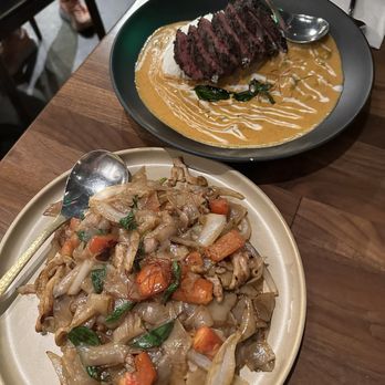 Hanuman Thai Eatery - Drunken noodle & Panang curry with hanger steak - Thai Near Me - Costa Mesa, California Hanuman Thai Eatery - Drunken noodle & Panang curry with hanger steak - Thai Near Me - Costa Mesa, California