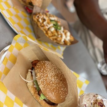 CHA Street Food - a burger and fries on a table - Coffee & Tea Near Me - Tysons, Virginia