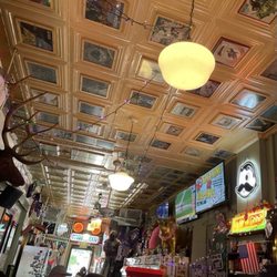 Morsberger's Tavern - Facing Main Street at the dimly-lit bar, albums on the ceiling, who-knows-what on the walls, and some tvs