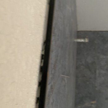 Rock Your House Remodeling - Area not textured or closed properly such as area behind trim and shower wall is exposed; not to mention lack of any kind of water proofing - General Contractors Near Me