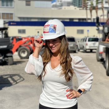 M.E.D. Expeditors - a woman in a hard hat talking on a cell phone - Architects Near Me - Coral Gables, Florida M.E.D. Expeditors - a woman in a hard hat talking on a cell phone - Architects Near Me - Coral Gables, Florida